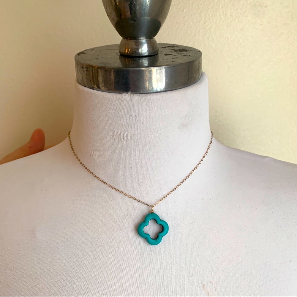 Cute gold tone necklace with turquoise pendant